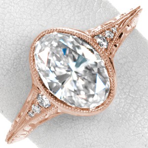 Rose gold engagement ring in Ottawa with full milgrain bezel, oval center and antique band.