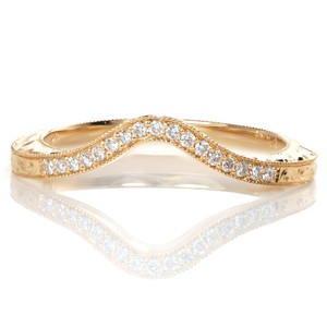 Micro pavé diamonds, hand engraving and milgrain texture create this heirloom masterpiece. The Rachel Lily Matching Band is hand crafted in 14k yellow gold and designed to wear next to the Rachel Lily engagement ring. The wedding band gently curves around the shape of the engagement ring for a perfect fit. 