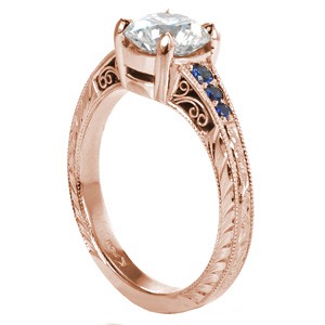 Rose gold engagement ring in Cleveland with blue sapphires, milgrain and round center stone.