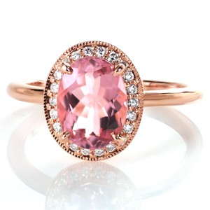 Rose gold engagement ring in Fargo with diamond halo and oval morganite center stone.