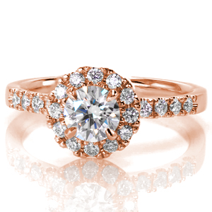A classic engagement ring style, Design 3535 is a bright halo design created for a 0.33 carat round brilliant center stone. This elevated center halo leaves room for a straight wedding band to sit flush next to the band. Prong settings match the diamonds on the band to the halo.