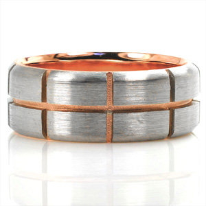 This two-tone wedding band is a stunning mix of texture and color. The lining is shown in high polished 14k rose gold. The outer band is shown in 14k white gold with beveled edges and a brushed finish. The outer layer is carefully separated by even, symmetrical grooves to show off the sand-blasted rose gold in between.