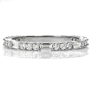 Rosalie is a beautiful band for a wedding, an anniversary, or a stacking ring set. A baguette diamond is alternated with three round diamonds to create a geometrical pattern. The mix of brilliant cut round diamonds and step-cut baguettes creates a dazzling sparkle.