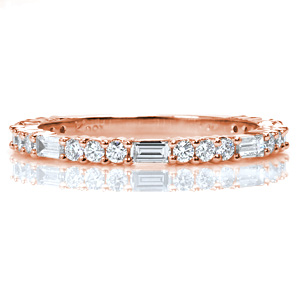 Rosalie is a beautiful band for a wedding, an anniversary, or a stacking ring set. A baguette diamond is alternated with three round diamonds to create a geometrical pattern. The mix of brilliant cut round diamonds and step-cut baguettes creates a dazzling sparkle.
