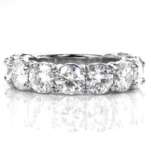Design 3568 is a wide band featuring ten large diamonds that span nearly three quarters of the way around the band. At nearly 5.00 carats total weight, this stunning band is an impressive statement piece. Each diamond is held in a four prong basket setting. 