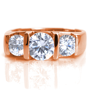 Bliss is a perfect representation of contemporary beauty. This modern engagement ring design is shown featuring a half-bezel set 1.00 carat round brilliant cut center stone framed with 0.50 carat side diamonds. The wide band is wide for an added sense of strength. The Euro-shank base mimics the top shape of the band.