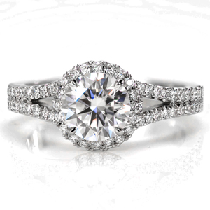 Design 3595 is crafted with a double row of micro pavé flowing gently in to a split shank band. The flare of the band rises up to meet the dazzling halo beneath the round brilliant center stone. The combination of split shank diamond band and halo create a classic style that remains timeless.