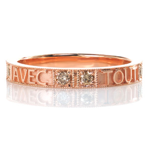 Looking for a perfect modern take on a posy ring? Design 3606 is a beautiful design featuring evenly spaced pairs of champagne diamonds. Beaded milgrain texturing is hand applied to the edges around the words and around each stone for an added vintage appeal.