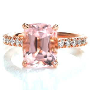 This classic U-cut micro pavé setting style is made modern with the combination of warm hued rose gold and the soft, pale peachy pink morganite center stone. The basket under the center stone is a subtle, elegant detail that complements the U-cut settings of the side diamonds. 