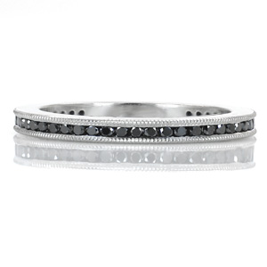 Black diamonds turn this channel set band into an eye-catching band for any occasion. The milgrain edges add texture and interest to the top of the band while the luster of the high polished sides creates shine to compliment the sparkle of the stones.