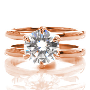 Design 3617 is a contemporary split shank design featuring an elegant, lacy, six-prong center stone setting. The two bands are matching widths and spaced to allow for a wedding band to rest between them. The luster of the high polished ring is a beautiful contrast to the sparkle of the center stone.