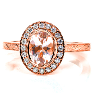 Design 3675 is a stunning diamond halo engagement ring featuring antique inspired details. The top of the band features a bright-cut hand-engraved pattern of flowing, vine-like scrolls. Milgrain texturing has been hand applied to the edges of the band, bezel, and halo.