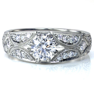 A unique custom ring, Design 3681 features a round brilliant cut center stone in an eight-prong setting. The band tapers slightly and has an alternating pattern of scallops and starbursts, embellished with diamonds and accented with a milgrain outline. 