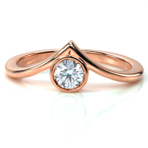 Great for stacking or on its own, Design 3701 showcases a bezel set 0.40 carat diamond in a high polish 14k yellow gold band. The band features feminine curves that come to a point, cradling the stone in warm metal. This modern design will stand the test of time.