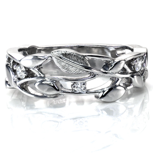 With sparkling diamonds woven into a beautiful leaf and vine design, Design 3728 is no ordinary band. This design works equally well as a wedding band or a stunning right hand ring. The crisp design is accentuated by intricate hand engraving on one of the leaves, adding beautiful texture and dimension. 