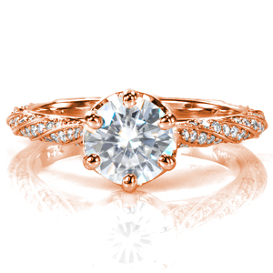 Design 3738 features a six prong setting around a 1 carat diamond. Swirling channels of diamonds adorn the cathedral style band, adding sparkle and texture. The decorative basket under the center setting also features scalloped channels of diamonds, making the profile of this design just as stunning as the top view. 