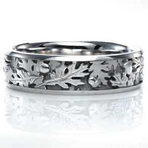 Design 3739 is all about layers and texture. This unique ring features a leaf and acorn motif with hand finished detailing. Some leaves are hand engraved and high polished, while others are sandblasted. Two high polished rails perfectly showcase this intricate design. 