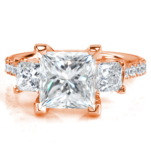 Not your average three stone ring, Design 3753 is sure to catch your eye! It features a staggering 2.70 carat Princess cut center stone, with over a full carat in side stones. The center stone is flanked with two more Princess cut diamonds, and round brilliant stones adorn the cathedral band.
