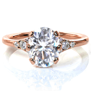 Based on a vintage ring, Design 3788 features a 1.5 carat diamond held in a unique six prong setting. The high polished band flares into the center setting and holds clusters of five diamonds on each side of the elevated center setting, drawing the eye to the dazzling center stone. 