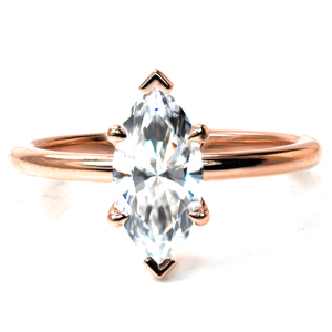 Refined elegance is the hallmark of our Marquise Petite solitaire. Gracefully curved prongs hold a 1.20 carat marquise cut diamond in a low setting. A thin, rounded band finishes this minimalist design and allows for endless combinations with wedding bands or stackable rings. 