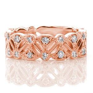 Las Estrellas has an elegant pierced pattern reminiscent of the vintage era. A scalloped edge and decorative marquise shaped openwork creates an eye catching design. The piece is embellished with 0.55 carats of round diamonds for added radiance. The edges are framed with milgrain detail for an added antique feel. 