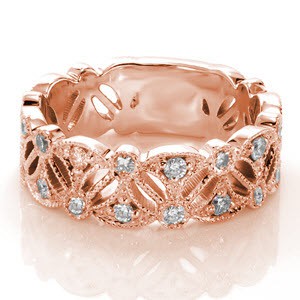 Rose gold wedding ring in Anaheim with elegant pierced pattern and diamonds. 