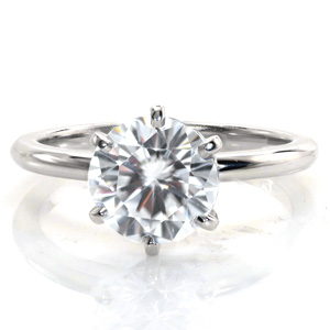 Our Ladie is an elegant and refined spin on the classic six prong solitaire. A stunning 2 carat diamond is held in six perfectly polished and uniquely shaped prongs. Beautifully engineered to allow our master jewelers to polish even every interior surface, Ladie shines from every angle.