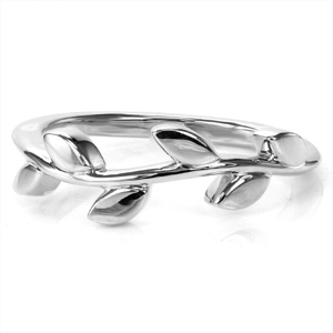 Organic and flowing, this lovely design is reminiscent of a delicate vine wrapped around your finger. High polished metal leaves are staggered on the gently curved band. Simple and elegant, this ring works beautifully as part of a stack or worn on its own. 