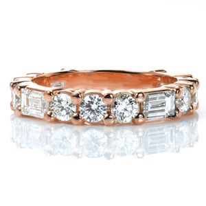 A true statement band for a wedding, an anniversary, or a stacking ring set, this design is sure to catch your eye! A baguette diamond is alternated with three round diamonds to create a geometrical pattern. The mix of brilliant cut round diamonds and step-cut baguettes creates a dazzling sparkle.