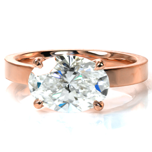 A modern twist on a classic solitaire, Design 3869 features a stunning 3.5 carat in an east/west setting. The flat band is a perfect complement to the contemporary setting style which is finished with a delicate draped basket and four small claw prongs. 
