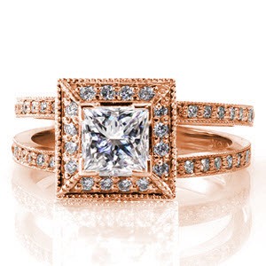 An opulent design covered with micro pavé, the Princess Cielo features a split shank band and a square halo. The 0.75 carat princess cut diamond is set in place with chevron prongs to protect the corners of the stone. The smooth, straight edges of this design are finished with milgrain detail.