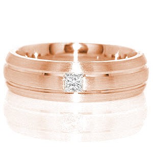 Knox Jeweler's Miami is a unique contemporary gent's band featured in 14k white gold. Two grooves evenly spaced, run parallel along the design in a high polish finish. The raised surface is given a matte finish, giving depth to the channels. A 0.15 carat princess cut is fashioned in center of the band for interest.   