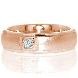 Our San Diego design features a unique and eye-catching row of facets along the ring rails. The polished facets are offset with a smooth matte finish center. A princess cut diamond totaling .10 carats is full bezel set within the 14k white gold for added distinction.   
