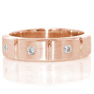 Constructed from 14k white gold, the Brooklyn band has a total of 0.18 carats of flush set round cut diamonds. The diamonds are set into the center of three sections along the top of the ring which are separated by high polished grooves. The band has beveled edges for a great fit.