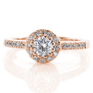 The Classic Halo is a charming design with a unique setting. The 0.50 carat round brilliant cut center diamond is set with twelve prongs to form a decorative circle. The round halo and top of the band are accented with magnificent micro pavé. The rest of the band is finished with a high polish.