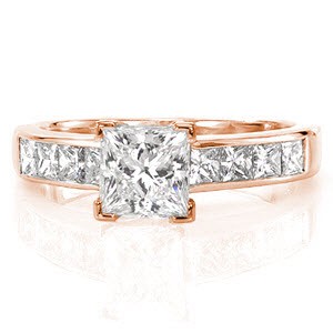 Obtaining absolute appeal, the Serendipity design exhibits refinement in every angle. The bold 1.00 carat princess cut center diamond is guarded by squared prongs. Within the 14k white gold band are channel set princess cut diamonds. The high polished band arches at the shoulders for a streamlined design.