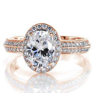 Denver rose gold halo engagement ring with oval center stone and a double row diamond band.